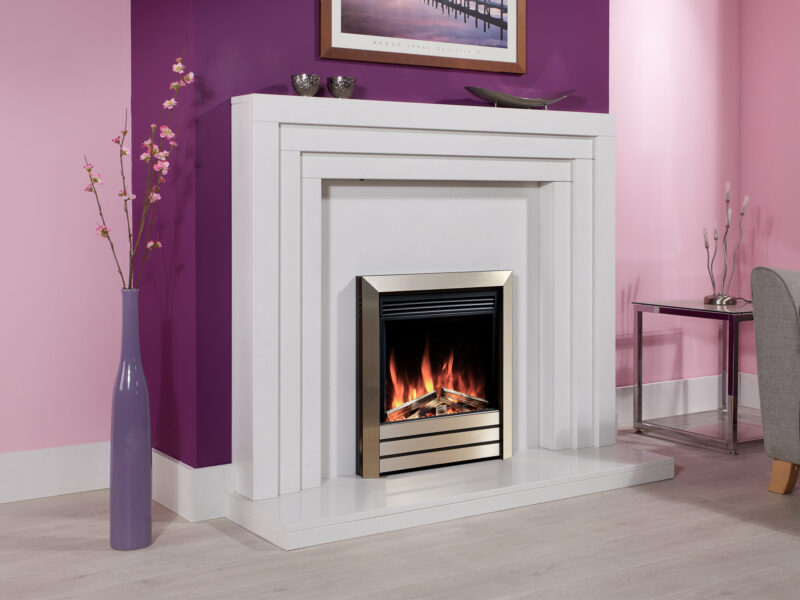 Contemporary marble fireplace in white marble with an electric fire, on a Lilac painted chimney breast with limed oak flooring