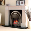 Portuguese limestone fireplace with an electric highlighted cast iron and black granite hearth.